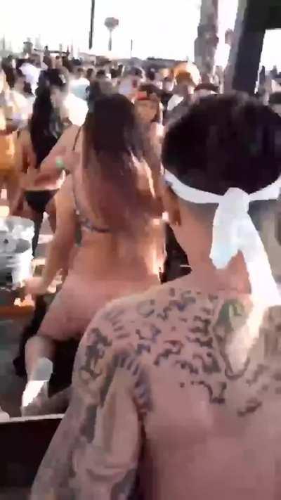 A girl rides a BBC in front of a crowd