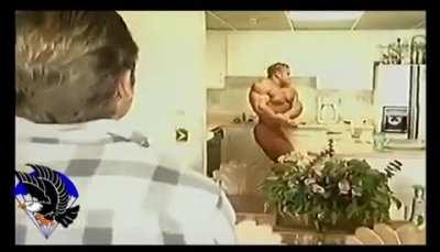 Jay Cutler posing around 20 years ago in front of his coach, Chris Aceto. 