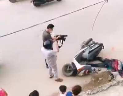 Youtuber taking video of accident instead of helping the guy. Source: Twitter