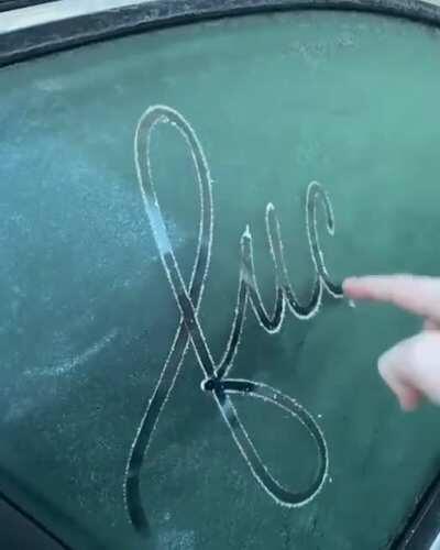 Writing on a frosted window.