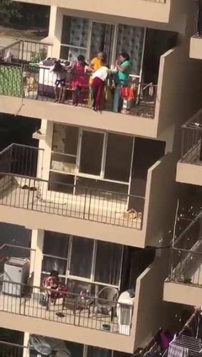 Boy gets lowered from 10th floor to 9th floor to pick up dropped laundry