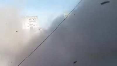 Video of a russian vehicle shooting at possibly civilian building, location and date is unknown to me (CHECK DESC)