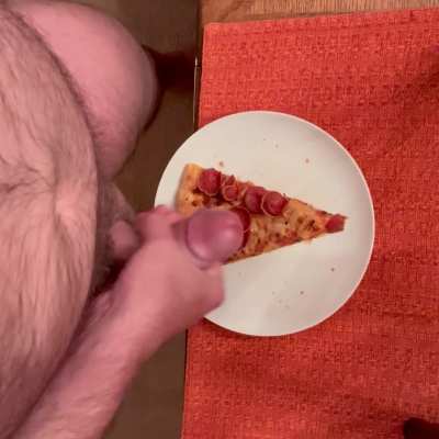 Adding white sauce to pizza