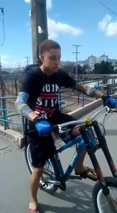 Cycling down a flight of stairs without shoes or helmet or any protective gear.