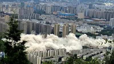 15 tower blocks get demolished simultaneously in the Yunnan Province of China, August 27.