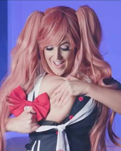 Sexy Angela White posing as a busty schoolgirl in her uniform teasing you with her big tits