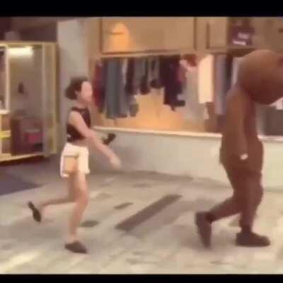 So the guy in the bear costume is a soldier went back after mission, trying to surprise his girlfriend..