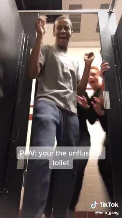 he is picking up the entire toilet and putting it in his mouth