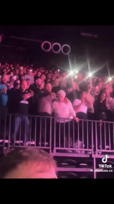 A mum enjoying 50 cent concert with her son.