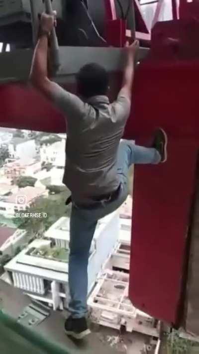 Climbing the crane from a building