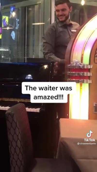 Father convinces his son to play the piano at the airport. His son works up the courage and plays to everyone’s great pleasure.