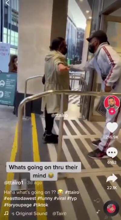 A random guy stands in front of a store entrance with a sticky roller and no one asks a question. Matrix people.