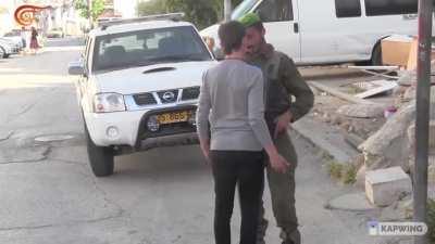 Everyday life in Palestine, Hebron, Palestinians have to deal everyday with teenage Zionist boys with a gun