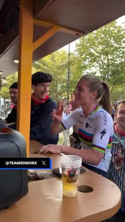 Pro Cyclist hears fans chanting her name, joins their bike bar