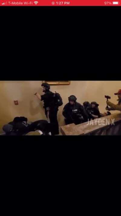 Terrorist attacking America, shot and killed by Heroic officer of the Law