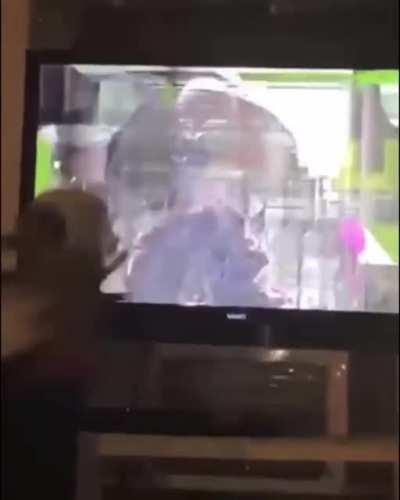 Sports fanatic takes his gangs out on the TV.