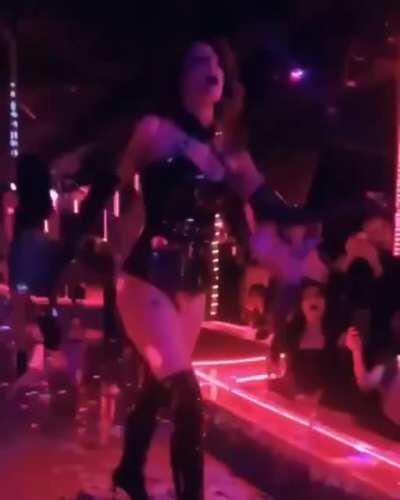 Halsey performing at a strip club