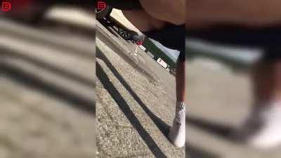 Dude takes a seat on towbar naked.