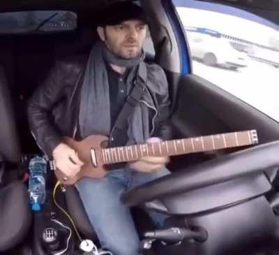 Playing guitar while driving!?