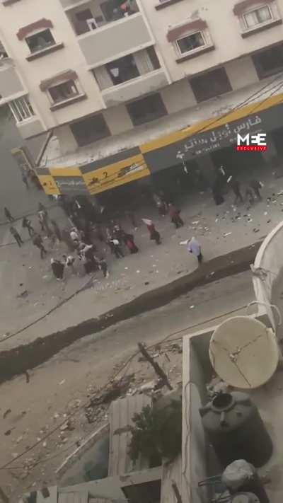 IOF shoots directly a Palestinian women with walking with a kid holding a white flag in Gaza. 