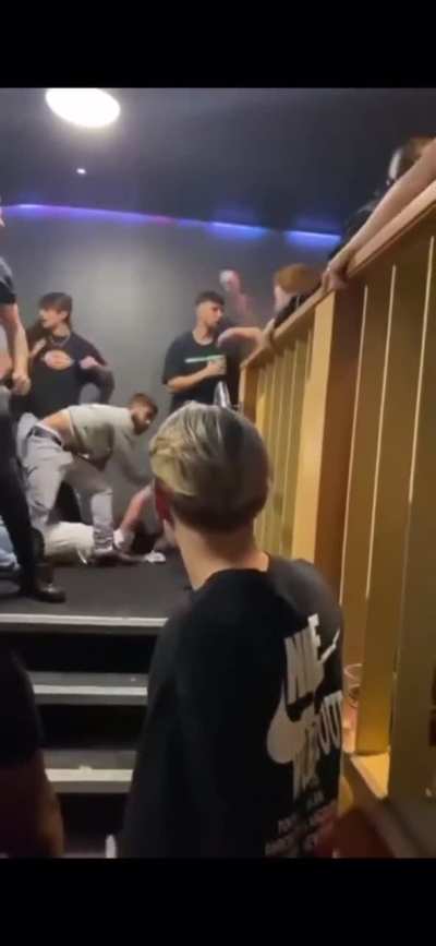 Light Blue shirt guy racking bodies up in a pile.