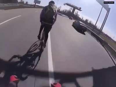 Biker nearly becomes part of the road