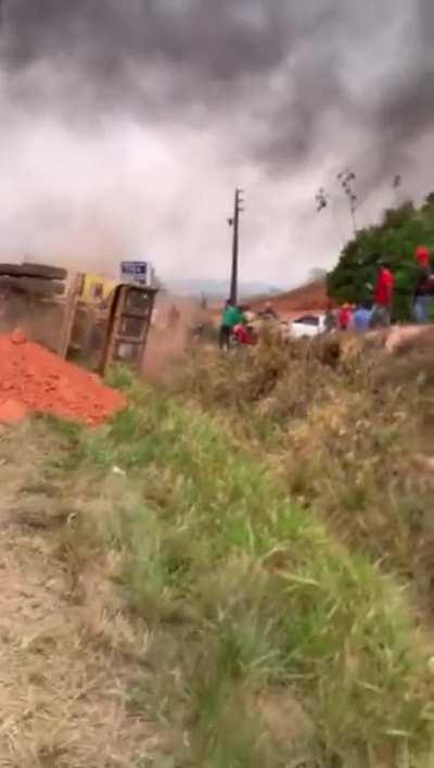 Bolsonaro Supporter blocking road by dropping dirt on the asphalt