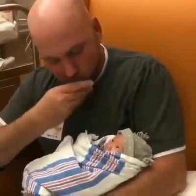 Deaf Father signing to his newborn daughter about how much he loves her