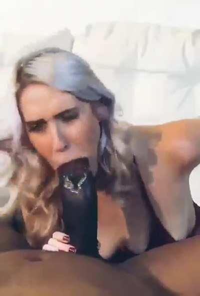 Sexy white girl sucking on a humongous black cock I’d love to see that monster destroy her holes