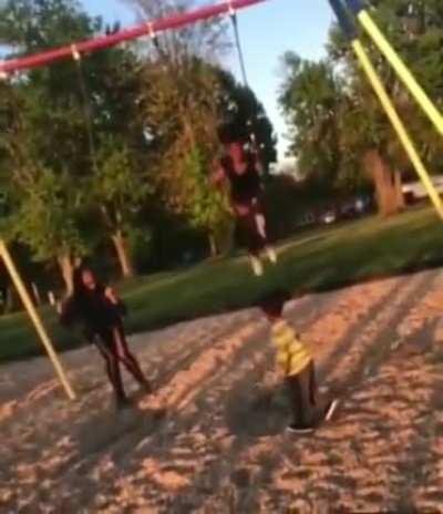 Kid oblivious to how swings work
