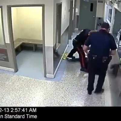An officer body slams a girl in cuffs