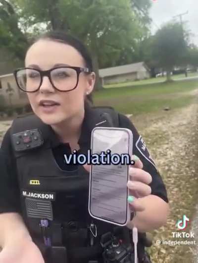 American police harass black woman for walking on the “wrong side” of the road in the suburbs.