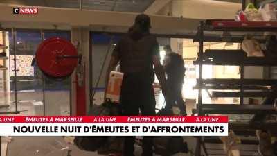 Stealing hours after the riot ended.