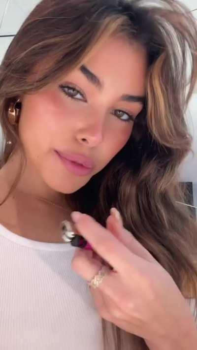 She sticks it in her mouth