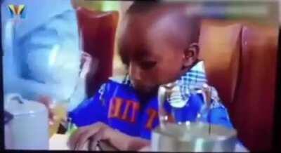 Kid forgets how to drink out of a cup