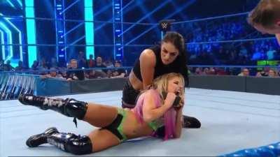 Sonya applies a tight chinlock as she controls a flailing and squirming Alexa