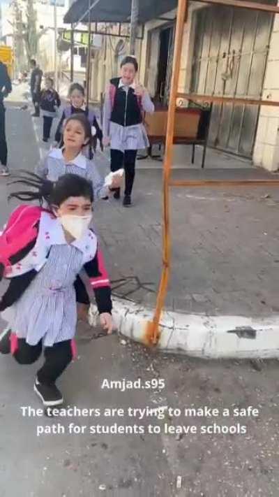 Soldiers fire tear gas canisters at an elementary school.