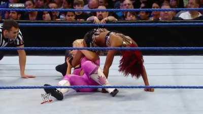 Alicia Fox works on Natalya's belly