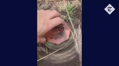 ua pov. American volunteer in Ukraine shows danger of clearing landmines in farm fields