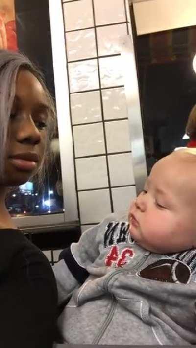 Baby staring at a woman..