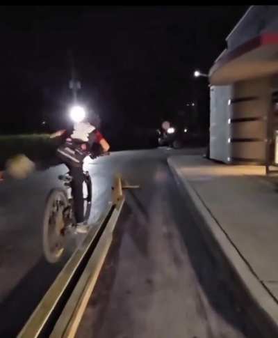 This kid balancing a bicycle on a very thin wire