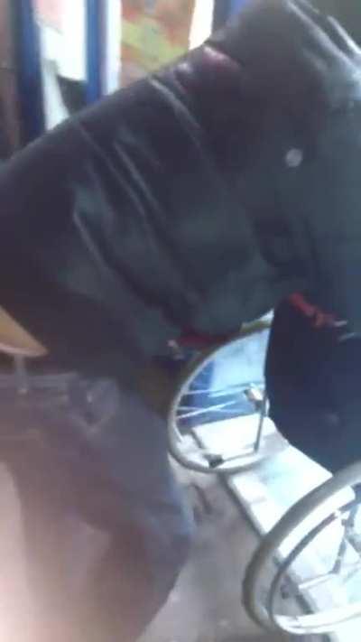 Guy in wheelchair trying to enter store