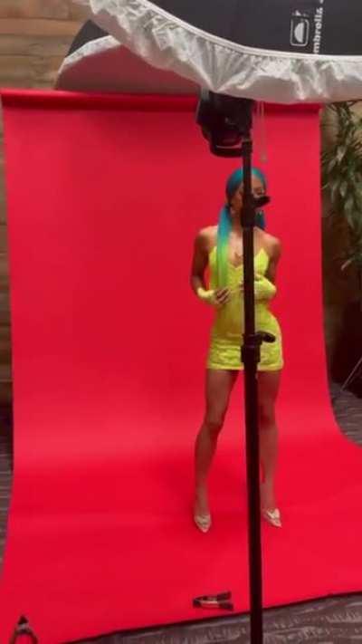 Posing in her sexy short tight dress and ponytail handlebars