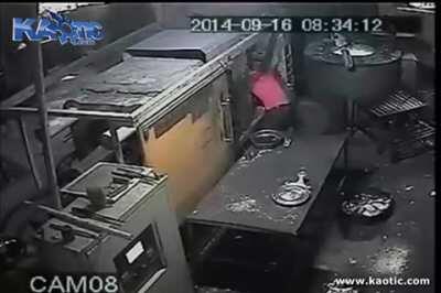 Dude stucks his head in some kind of compacter