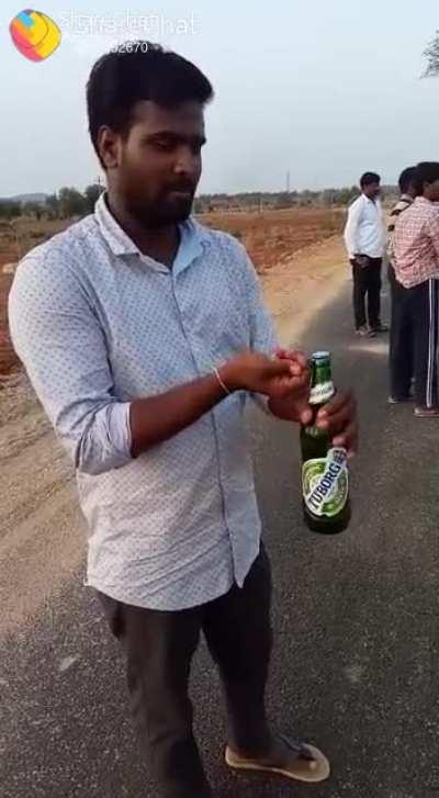 Man empties beer bottle in under 3 seconds!