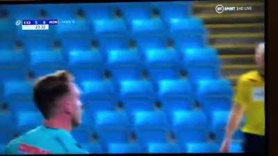 Rugby player celebrates a try by spinning the ball behind him, lands right in his hands when it comes down.