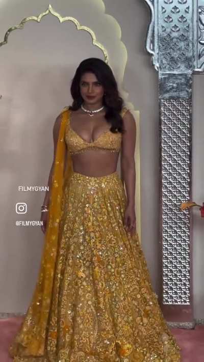 Priyanka chopra showing off her dusky chocolaty body in a skimpy top