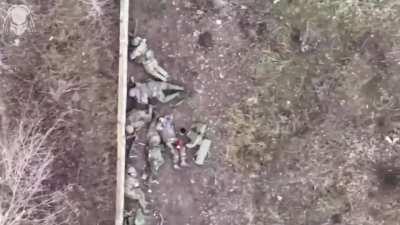 Barely alive group of orcs lying next to a wall is peppered by a grenade