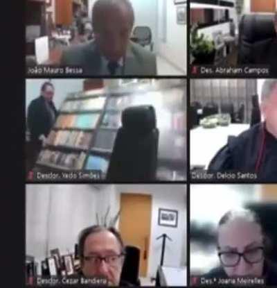 A judge in Brazil used a fake bookshelf for his court sessions and it felt during one of them