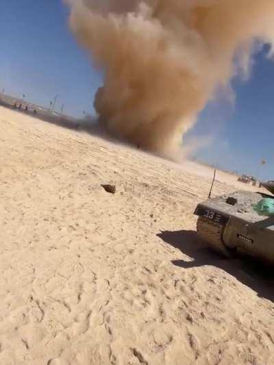 Soldiers rushing into dust devil
